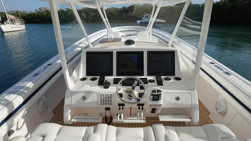 Slide: The Image of 2016 Intrepid 475 Panacea boat cockpit with advanced navigation systems. - 14