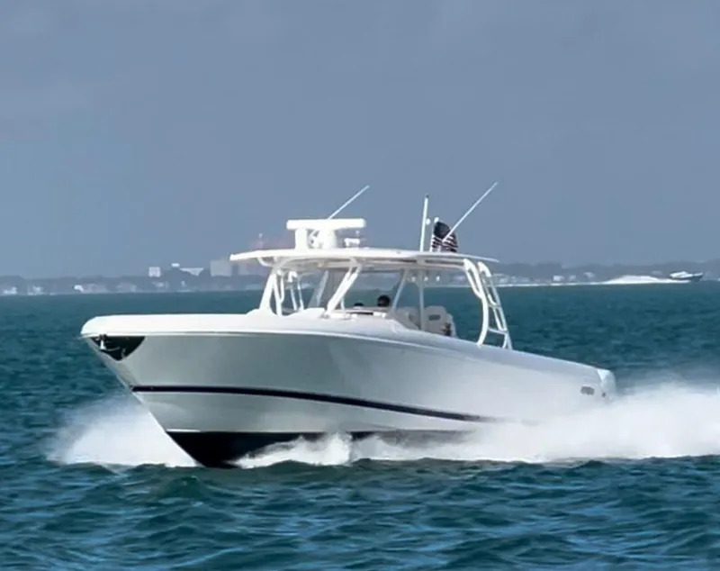 Slide: The Image of 2016 Intrepid 475 Panacea boat cruising on open water. - 20