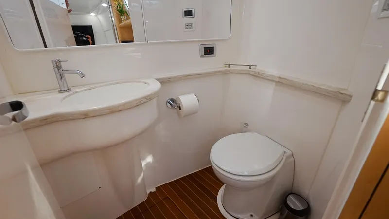 Slide: The Image of 2016 Intrepid 475 Panacea boat bathroom with sink and toilet. - 27