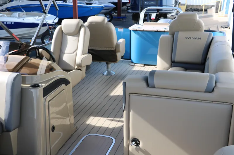 Slide: The Image of Interior of 2025 Sylvan Mirage X3 Party Fish pontoon boat with beige seating. - 20