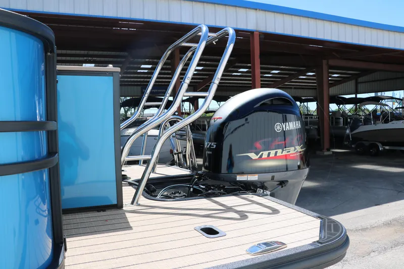 Slide: The Image of 2025 Sylvan Mirage X3 Party Fish pontoon boat with Yamaha outboard motor. - 6