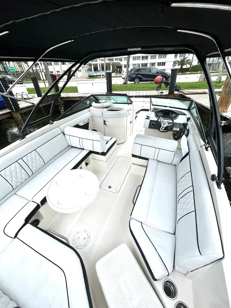 Slide: The Image of 2015 Sea Ray SDX 270 boat interior with white seating and black accents. - 32