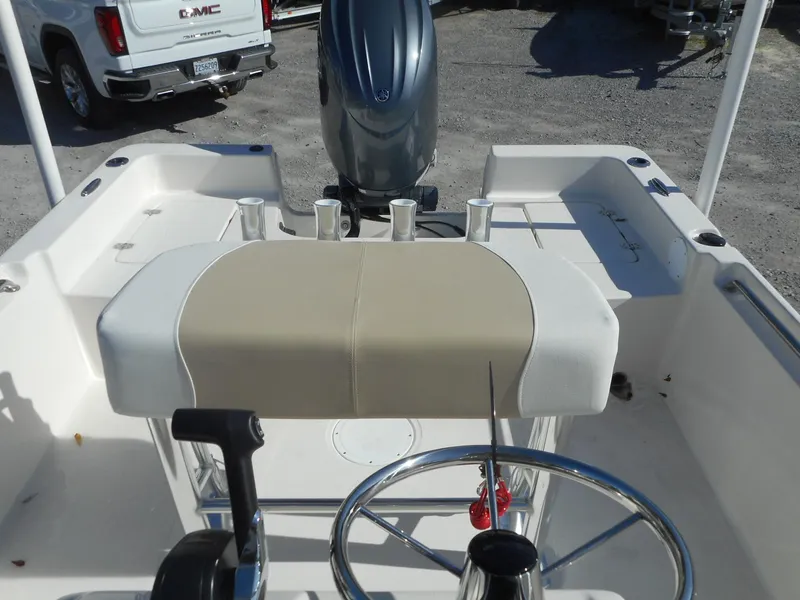 Slide: The Image of 2024 Bulls Bay 2000 boat interior with steering wheel and seating. - 6
