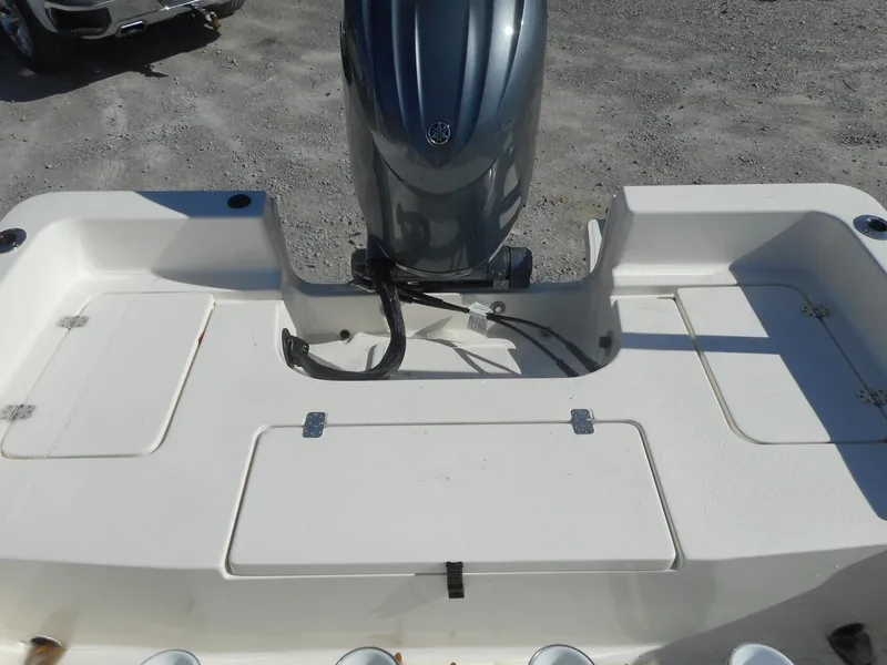 Slide: The Image of 2024 Bulls Bay 2000 boat stern with outboard motor and storage compartments. - 7