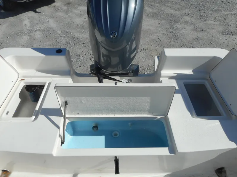 Slide: The Image of 2024 Bulls Bay 2000 boat stern with livewell and storage compartments. - 8