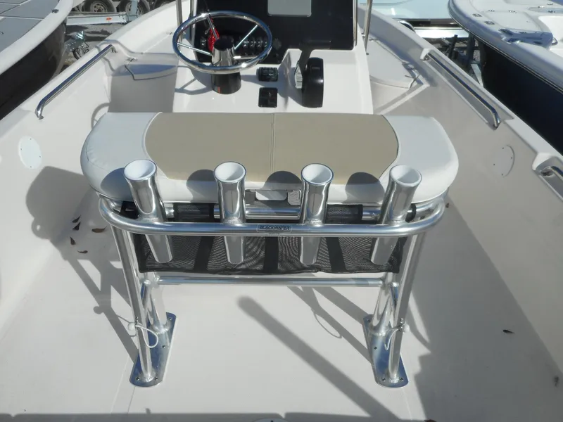 Slide: The Image of 2024 Bulls Bay 2000 boat interior with steering wheel and rod holders. - 9
