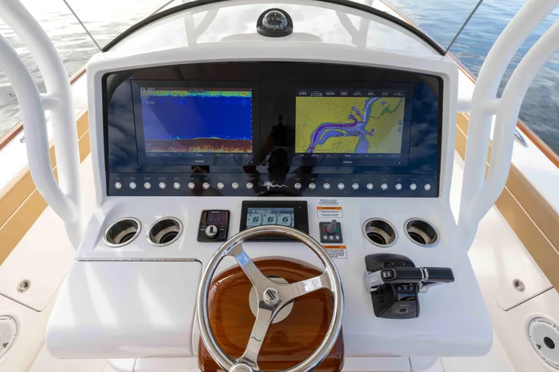 Slide: The Image of 2021 Valhalla Boatworks V37 helm with navigation screens and controls. - 15
