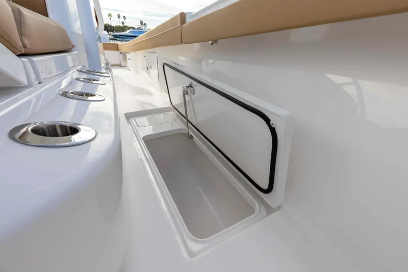 Slide: The Image of 2021 Valhalla Boatworks V37 interior storage compartment and rod holders. - 16