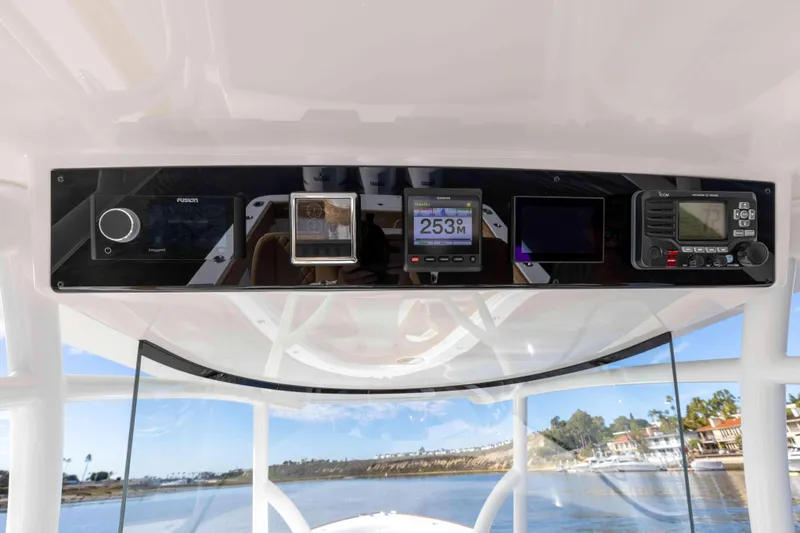 Slide: The Image of 2021 Valhalla Boatworks V37 dashboard with navigation and control instruments. - 18