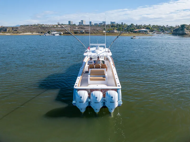 Slide: The Image of 2021 Valhalla Boatworks V37 on calm water with triple outboard engines. - 30
