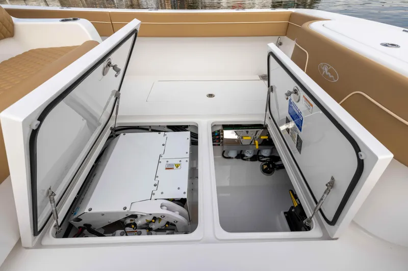 Slide: The Image of 2021 Valhalla Boatworks V37 open storage compartments showcasing internal components. - 5