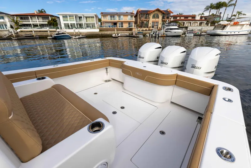 Slide: The Image of 2021 Valhalla Boatworks V37 with triple outboard engines docked in a marina. - 9