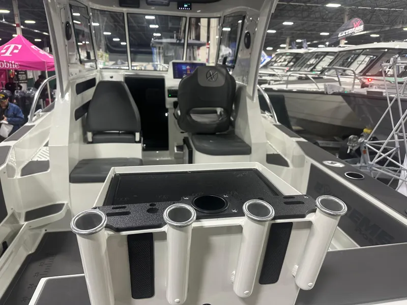 Slide: The Image of Bait Station Rod Holders and looking into 646 Extreme Boats walk around  - 2