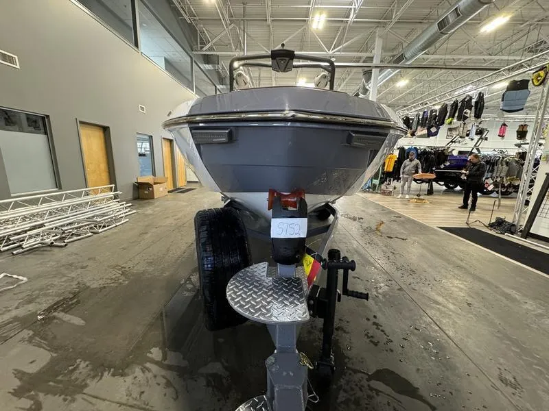 Slide: The Image of 2024 Malibu 23 LSV boat on trailer in indoor showroom. - 10