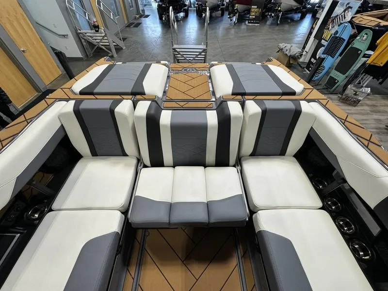 Slide: The Image of 2024 Malibu 23 LSV boat interior with luxurious seating and modern design. - 12