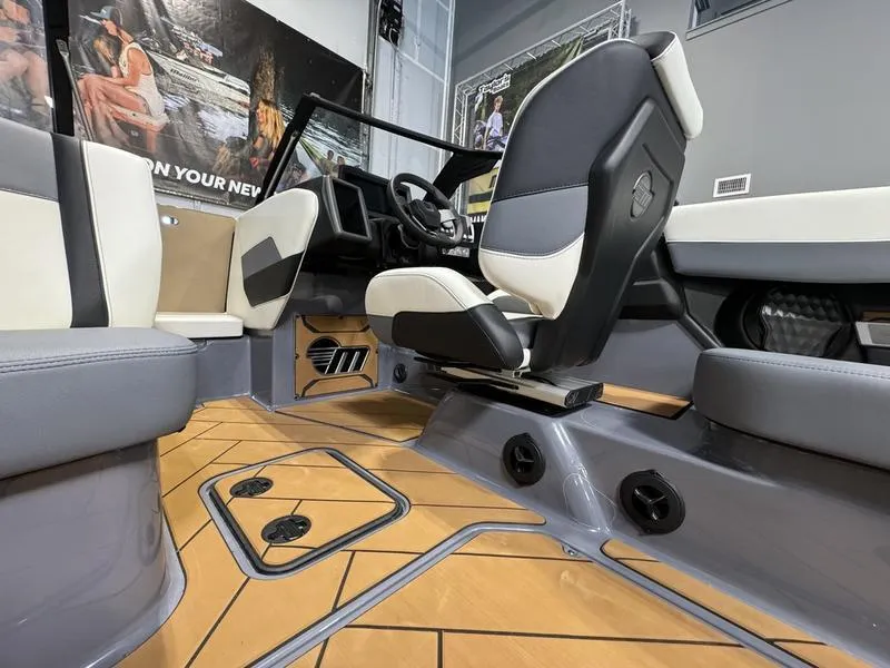 Slide: The Image of 2024 Malibu 23 LSV boat interior with modern seating and sleek design. - 2
