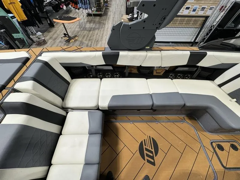 Slide: The Image of 2024 Malibu 23 LSV boat interior with stylish seating and modern design. - 8