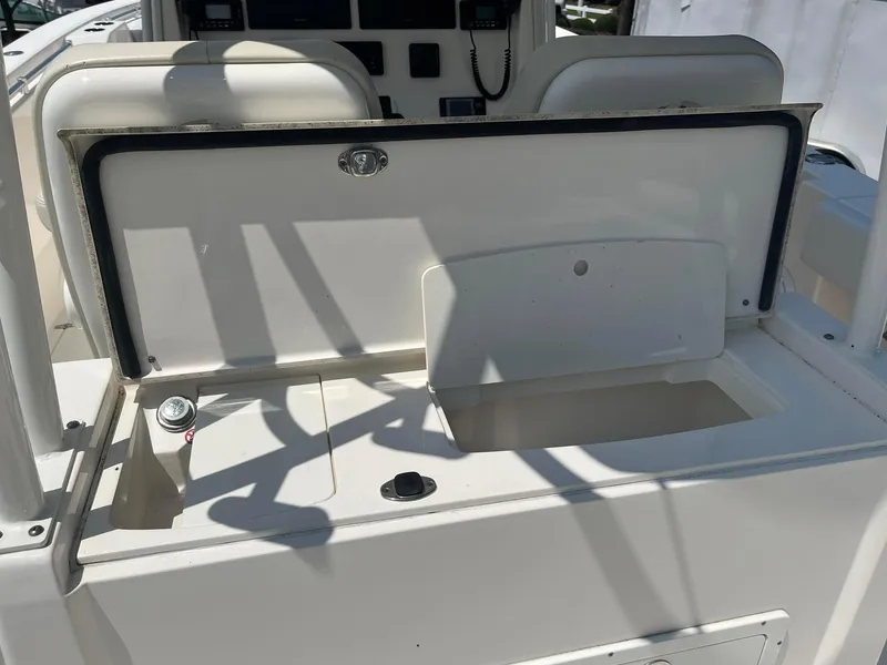 Slide: The Image of Open storage compartment on 2019 Cobia 320 CC boat deck. - 17