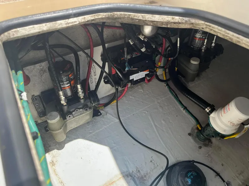 Slide: The Image of 2019 Cobia 320 CC boat interior wiring and components. - 26