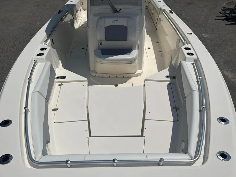 Slide: The Image of 2019 Cobia 320 CC boat interior with spacious seating and sleek design. - 8