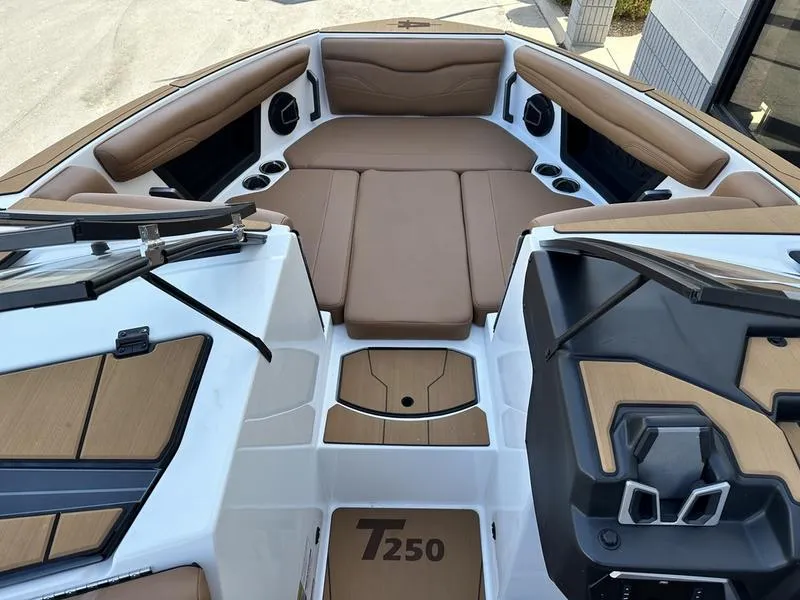 Slide: The Image of 2024 Axis T250 boat interior with tan seating and modern design. - 10