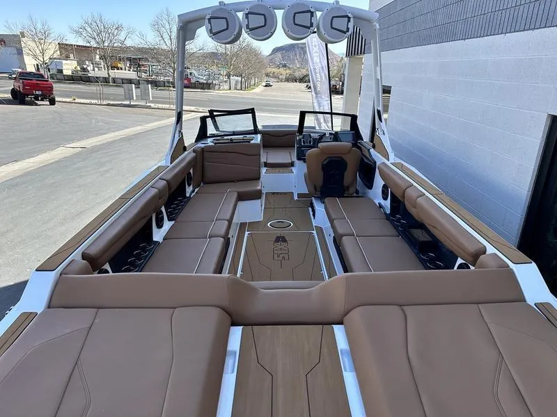 Slide: The Image of 2024 Axis T250 boat interior with tan seating and modern design. - 6