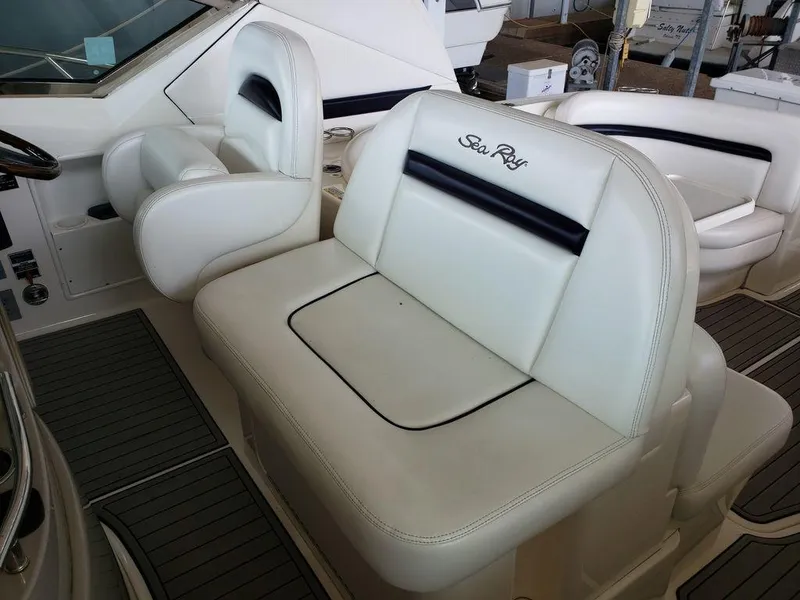 Slide: The Image of 2008 Sea Ray 38 Sundancer white leather seating in cockpit area. - 12