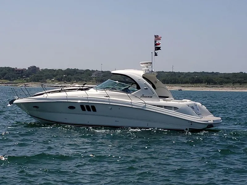 Slide: The Image of 2008 Sea Ray 38 Sundancer yacht cruising on open water. - 16