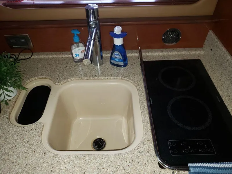 Slide: The Image of Galley sink and stove in 2008 Sea Ray 38 Sundancer yacht. - 22