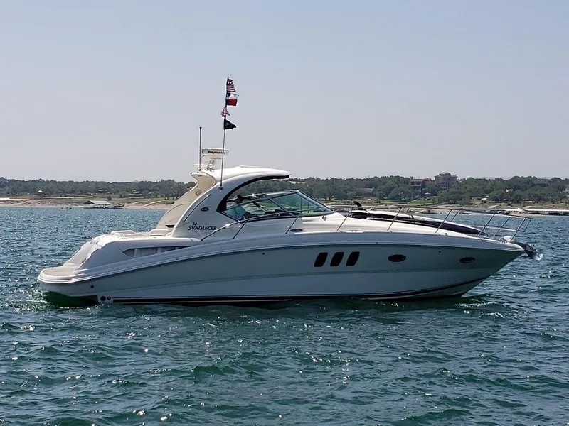 Slide: The Image of 2008 Sea Ray 38 Sundancer yacht on open water. - 28