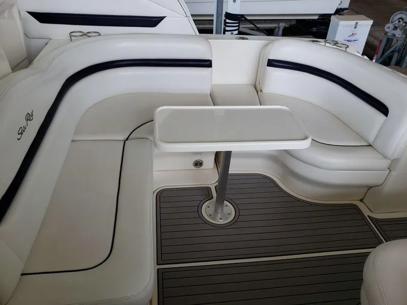 Slide: The Image of 2008 Sea Ray 38 Sundancer boat interior with white seating and table. - 35