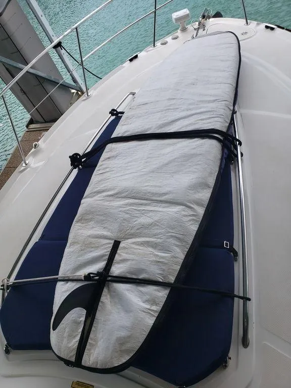 Slide: The Image of 2008 Sea Ray 38 Sundancer with surfboard on deck. - 39