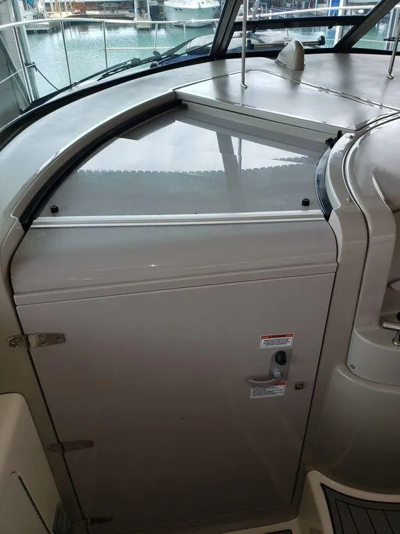 Slide: The Image of 2008 Sea Ray 38 Sundancer cockpit area with closed hatch. - 7