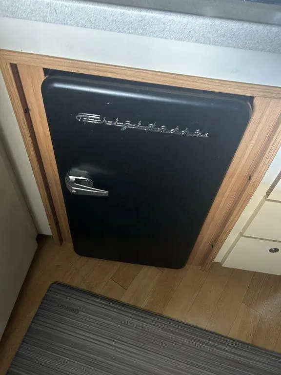 Slide: The Image of Black refrigerator in 1997 Wellcraft 3600 Martinique boat kitchen. - 12