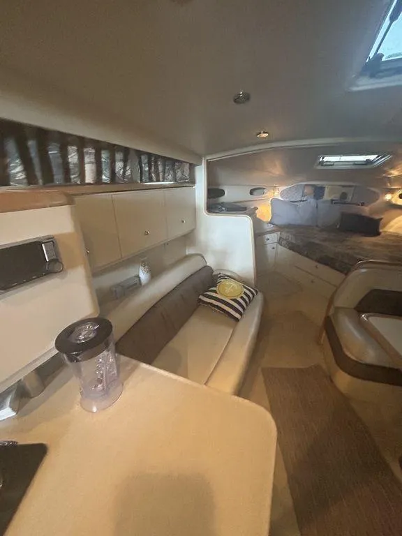 Slide: The Image of Interior of a 1997 Wellcraft 3600 Martinique yacht with seating and sleeping area. - 23