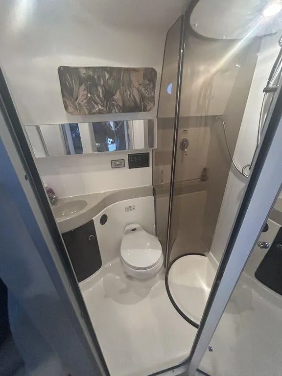 Slide: The Image of 1997 Wellcraft 3600 Martinique bathroom with modern fixtures and shower. - 26