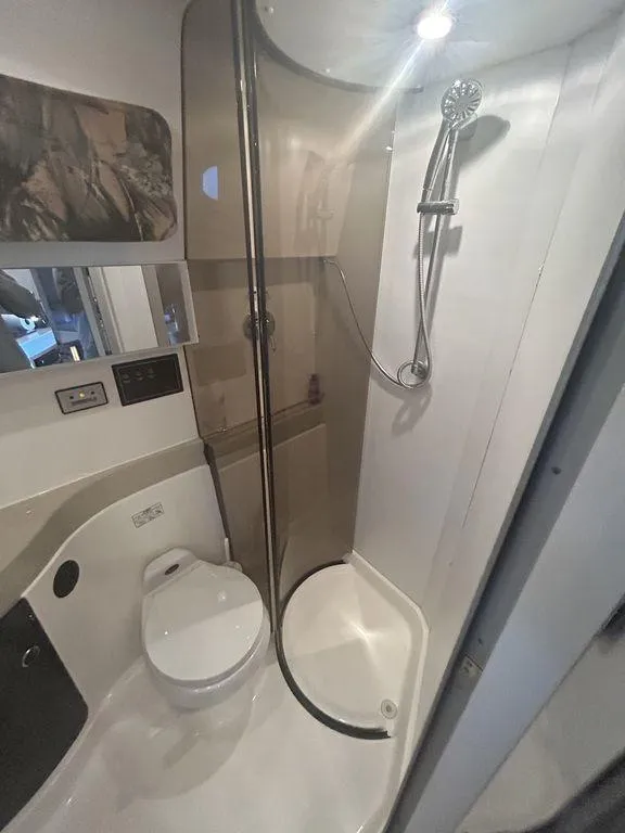 Slide: The Image of 1997 Wellcraft 3600 Martinique boat bathroom with shower and toilet. - 27