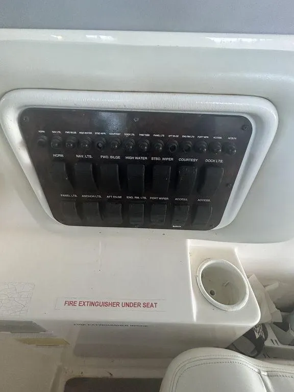 Slide: The Image of Control panel of a 1997 Wellcraft 3600 Martinique boat with labeled switches. - 29