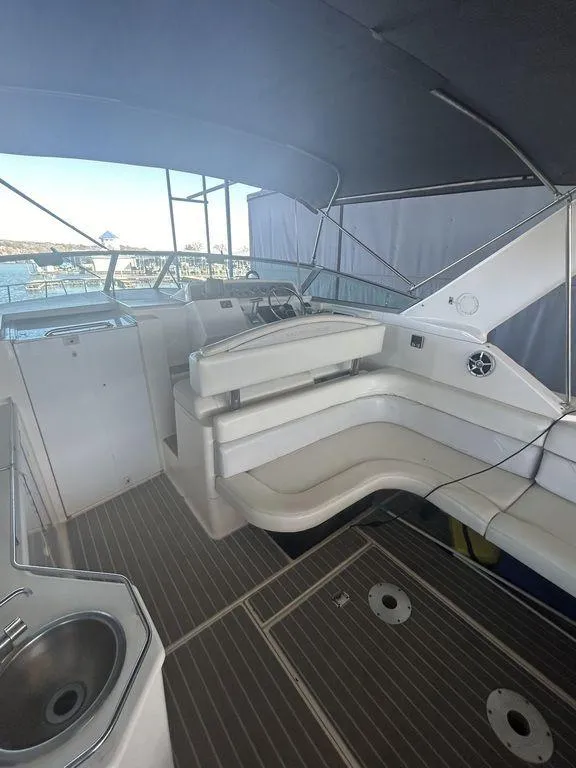 Slide: The Image of 1997 Wellcraft 3600 Martinique boat interior with seating and sink. - 30
