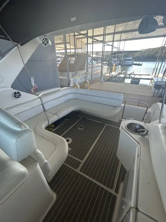 Slide: The Image of 1997 Wellcraft 3600 Martinique boat interior with dock view. - 35