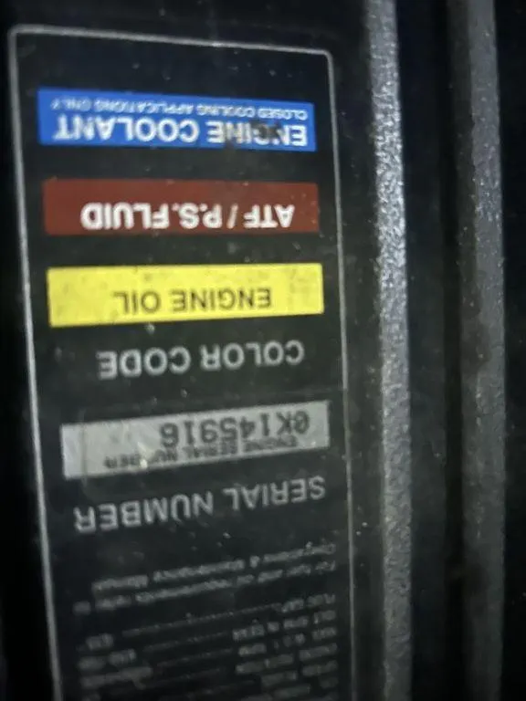 Slide: The Image of Label on a 1997 Wellcraft 3600 Martinique boat showing engine coolant and fluid information. - 38