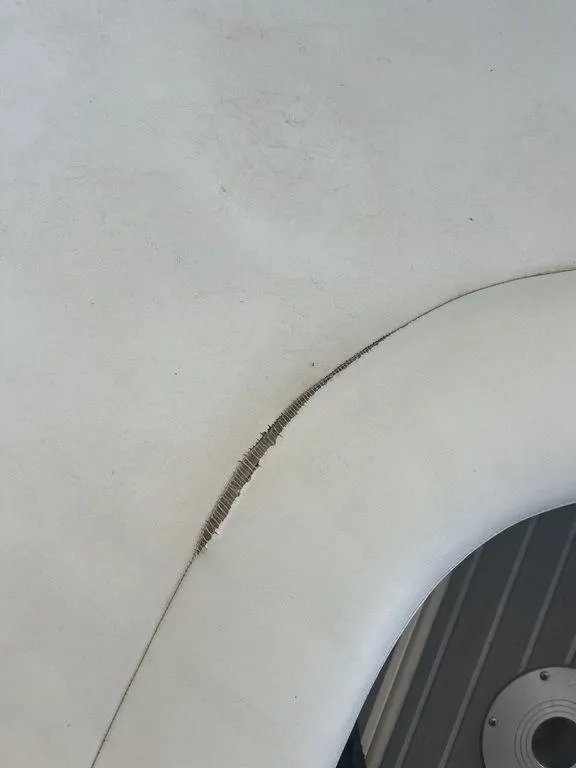 Slide: The Image of Close-up of damaged upholstery on a 1997 Wellcraft 3600 Martinique boat. - 41