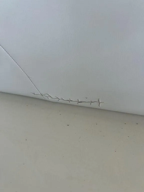 Slide: The Image of Torn upholstery on a 1997 Wellcraft 3600 Martinique boat. - 42