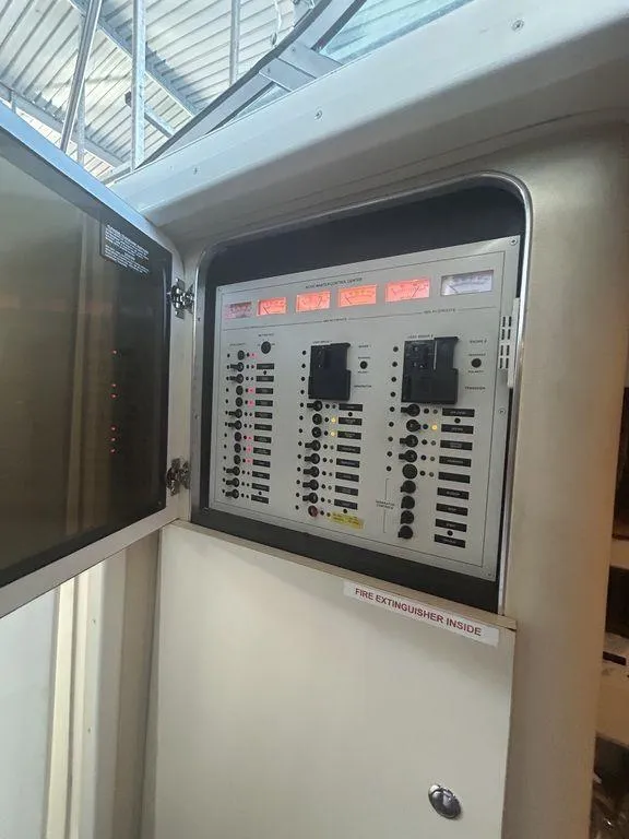 Slide: The Image of Electrical control panel on a 1997 Wellcraft 3600 Martinique boat. - 44