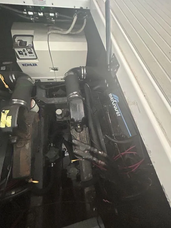 Slide: The Image of Engine compartment of a 1997 Wellcraft 3600 Martinique with MerCruiser and Kohler generator. - 46