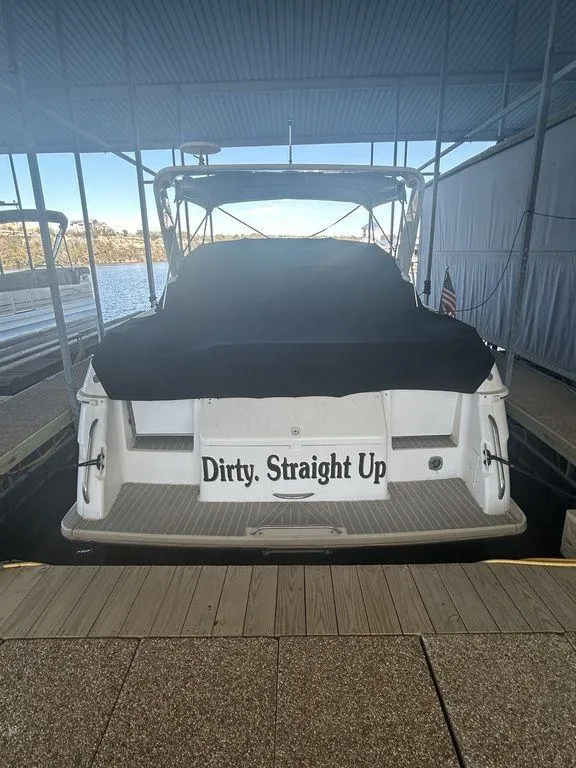 Slide: The Image of 1997 Wellcraft 3600 Martinique boat docked with Dirty. Straight Up nameplate. - 6