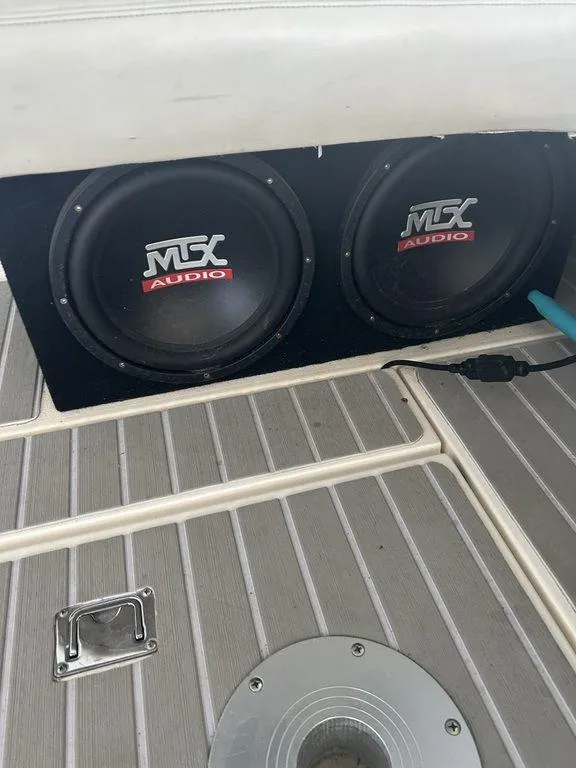 Slide: The Image of MTX Audio speakers on the deck of a 1997 Wellcraft 3600 Martinique boat. - 7