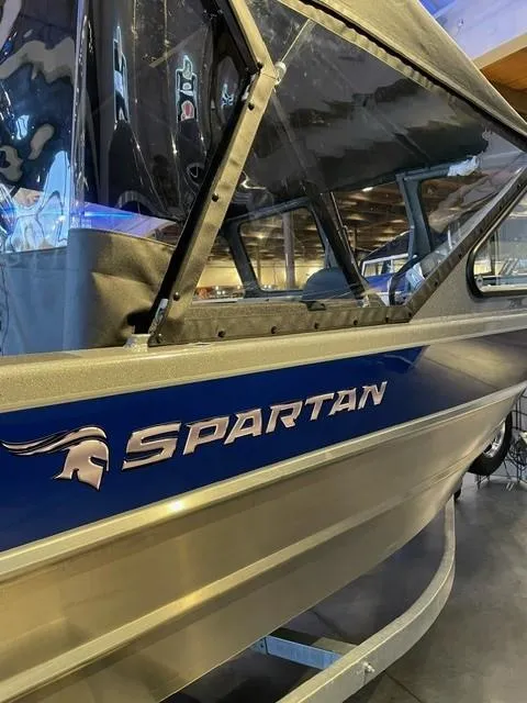 Slide: The Image of 2024 Spartan 185 Astoria boat in showroom. - 2