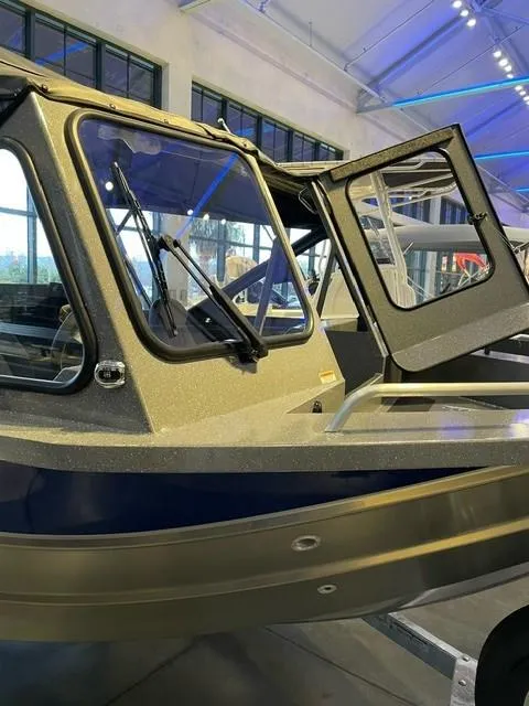 Slide: The Image of 2024 Spartan 185 Astoria boat on display in a showroom. - 3