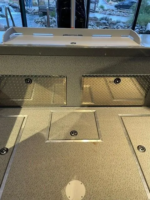 Slide: The Image of 2024 Spartan 185 Astoria boat interior with storage compartments. - 7